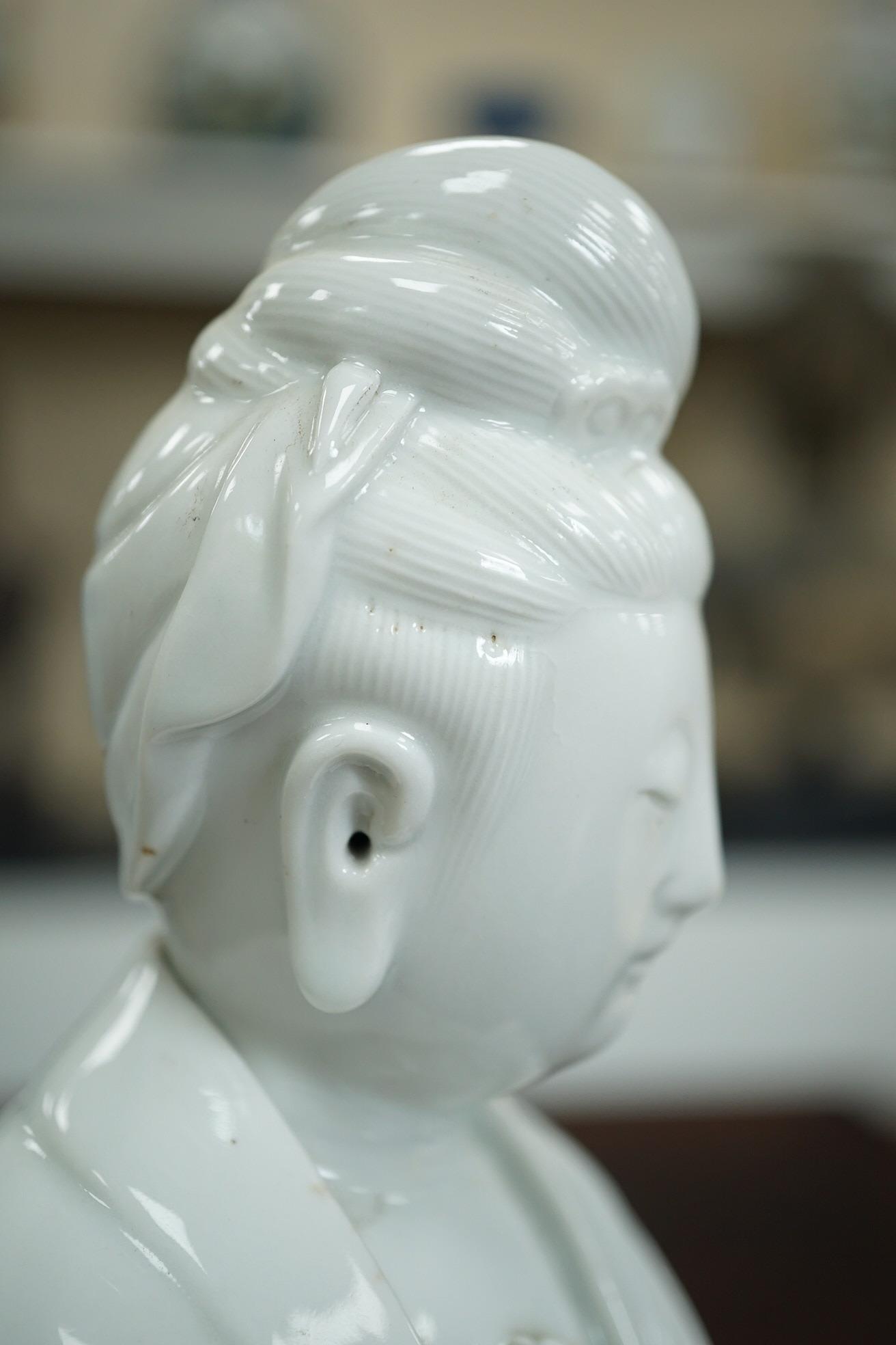 A Chinese blanc-de-chine seated figure of Guanyin, late 19th/early 20th century